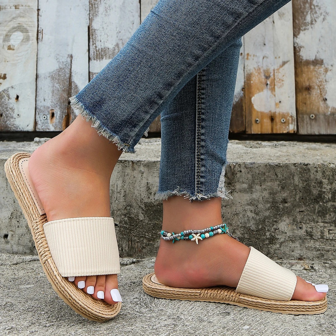 Beige flip-flops with a soft sole and a flat heel