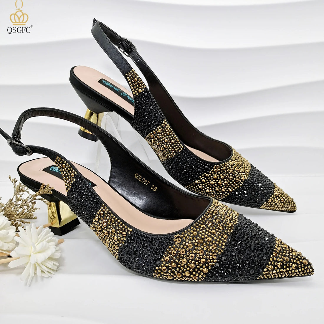 Black high heel shoes with crystal embellishment and strap