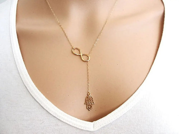 Gold Necklace with Infinity and Hand of Fatima Symbol of Protection and Harmony