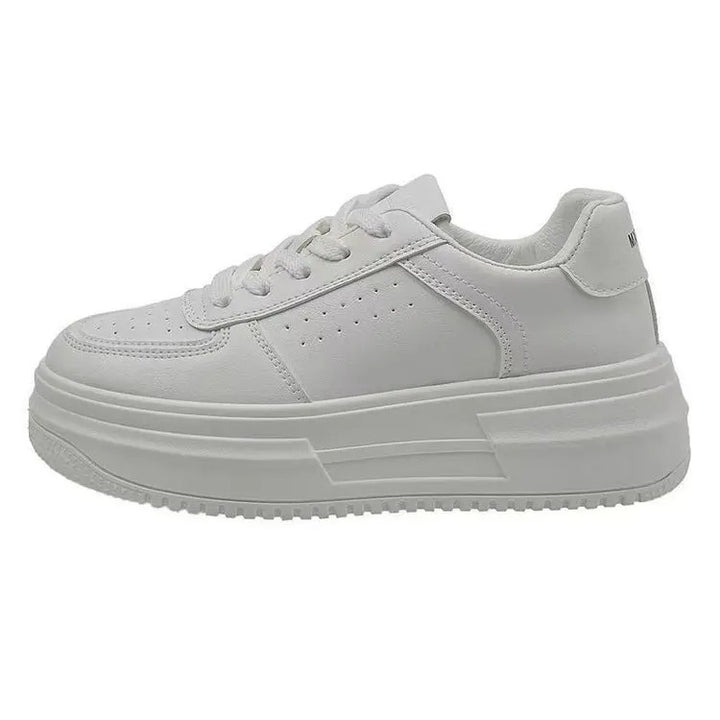 White women's sneakers on the platform